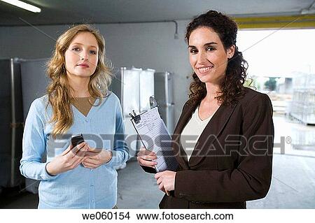 businesspeople, cell phone, businesswoman, Attache case View Large Photo Image Picture - businesspeople, cell phone, businesswoman, Attache case. Fotosearch