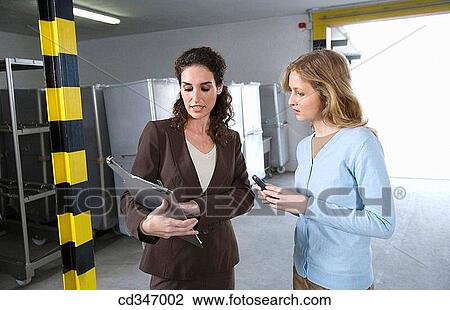 Stock Image - businesspeople, colleague, businesswoman, Attache case. Fotosearch