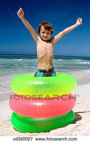 catch, Arms open, boy, beach, Arms raised, amusement View Large Photo Image Stock Photo - catch, Arms open, boy, beach, Arms raised, amusement. Fotosearch