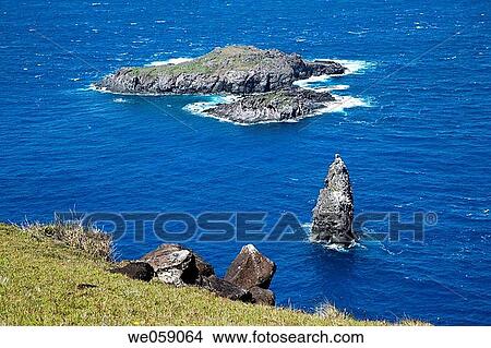 Chile, Easter Island, Rapa Nui, Orongo, Cabo Te Hanga, view of Motu Nui, Motu Iti and Motu Kao where the Rapa Nui Birdman Cult took place by obtaining in a competition the first eggs of the sooty tern from the islets. View Large Photo Image Picture - Chile, Easter Island, Rapa Nui, Orongo, Cabo Te Hanga, view of Motu Nui, Motu Iti and Motu Kao where the Rapa Nui Birdman Cult took place by obtaining in a competition the first eggs of the sooty tern from the islets.. Fotosearch