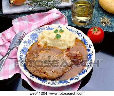 Picture - Chops in wine sauce. Fotosearch