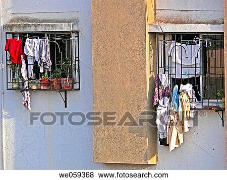 Cloths hanged on outside of the flats windows. Pune, Maharashtra, India. View Large Photo Image Stock Photo - Cloths hanged on outside of the flats windows. Pune, Maharashtra, India.. Fotosearch