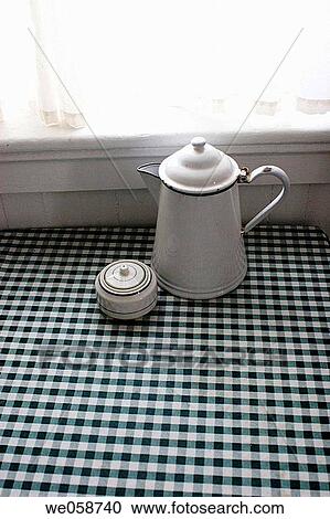 Coffee pot and sugar bowl on a table in front of a window View Large Photo Image Stock Image - Coffee pot and sugar bowl on a table in front of a window. Fotosearch