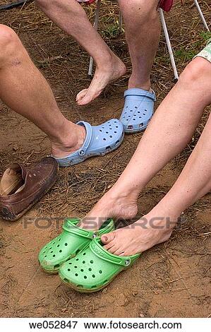 Colorful shoes in mud View Large Photo Image Stock Photo - Colorful shoes in mud. Fotosearch