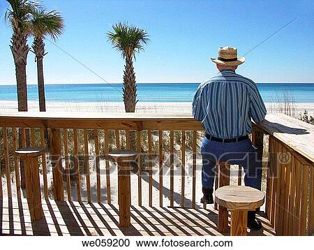 Elderly Man Sitting on Stool Looking Out at Beach View Large Photo Image Stock Image - Elderly Man Sitting on Stool Looking Out at Beach. Fotosearch
