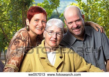 Elderly woman poses with her son and daughter View Large Photo Image Stock Image - Elderly woman poses with her son and daughter. Fotosearch