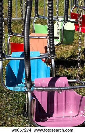 Empty seats on a carnival ride View Large Photo Image Picture - Empty seats on a carnival ride. Fotosearch