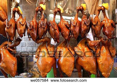 Freshly grilled ducks and chicken hanging in a food stall in Macau, China, Asia View Large Photo Image Picture - Freshly grilled ducks and chicken hanging in a food stall in Macau, China, Asia. Fotosearch