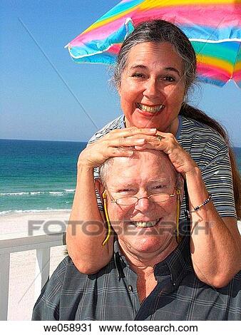 Happy Couple Having Fun on the Beach View Large Photo Image Stock Image - Happy Couple Having Fun on the Beach. Fotosearch