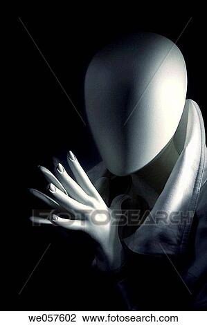 Stock Image - Mannequin praying. Fotosearch
