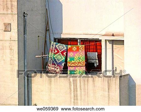 Mats spread for drying outside a balcony of a house. Pune, Maharashtra, India. View Large Photo Image Stock Photo - Mats spread for drying outside a balcony of a house. Pune, Maharashtra, India.. Fotosearch