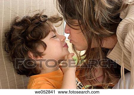 Mom and son kissing View Large Photo Image Stock Image - Mom and son kissing. Fotosearch
