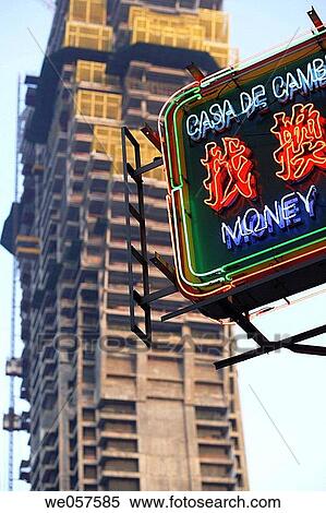 Stock Photography - Money Changer neon sign in front of the new high rise building of the new Lisboa Casino and hotel under construction, Macau, China, Asia. Fotosearch