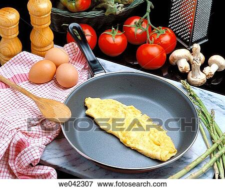 Omelet in Teflon frying pan View Large Photo Image Stock Photo - Omelet in Teflon frying pan. Fotosearch