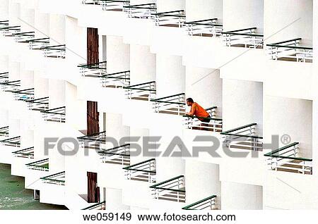 Person leaning over the balcony of the hotel View Large Photo Image Stock Photo - Person leaning over the balcony of the hotel. Fotosearch