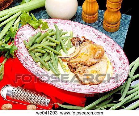 Stock Image - Pork chops with celery cream. Fotosearch