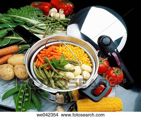 Pressure cooker with vegetables View Large Photo Image Picture - Pressure cooker with vegetables. Fotosearch