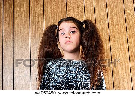 Preteen girl, with two large ponytails, posing View Large Photo Image Stock Image - Preteen girl, with two large ponytails, posing. Fotosearch