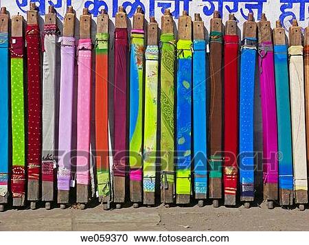 Saris winded up on wooden blocks and kept for drying after coloring process. Pune, Maharashtra, India. View Large Photo Image Stock Image - Saris winded up on wooden blocks and kept for drying after coloring process. Pune, Maharashtra, India.. Fotosearch