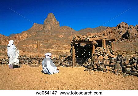 Tuareg men at prayer in a rudimentary outdoor mosque. Ahaggar Mountains, central Sahara, southern Algeria View Large Photo Image Stock Photo - Tuareg men at prayer in a rudimentary outdoor mosque. Ahaggar Mountains, central Sahara, southern Algeria. Fotosearch