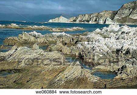 Twisted limestone rocks. Kaikoura waterfront. South Island. New Zealand View Large Photo Image Picture - Twisted limestone rocks. Kaikoura waterfront. South Island. New Zealand. Fotosearch