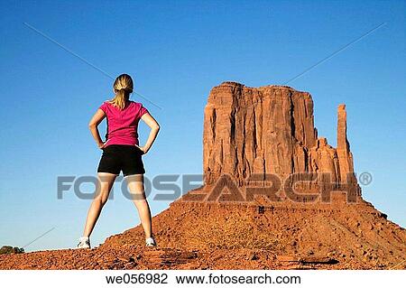 Usa. Arizona/Utha. Monument Valley. Navajo Tribal Park. Woman stretching View Large Photo Image Stock Image - Usa. Arizona/Utha. Monument Valley. Navajo Tribal Park. Woman stretching. Fotosearch