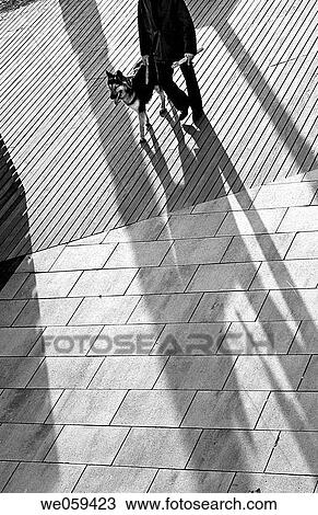 Walking the dog. Sant Salvador promenade. El Vendrell. Baix Pened? s. Tarragona province. Catalonia. Spain. View Large Photo Image Stock Image - Walking the dog. Sant Salvador promenade. El Vendrell. Baix Pened? s. Tarragona province. Catalonia. Spain.. Fotosearch