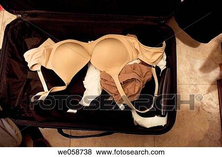 Stock Photo - Woman's packed suitcase.. Fotosearch