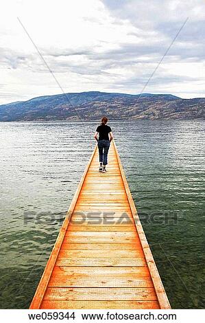 Women on the pier, Okanagan Lake, BC, Canada View Large Photo Image Picture - Women on the pier, Okanagan Lake, BC, Canada. Fotosearch