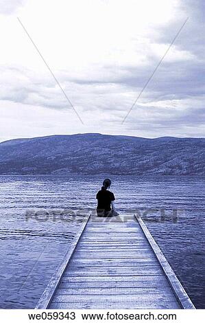 Women sitting on the pier, Okanagan Lake, BC, Canada View Large Photo Image Stock Image - Women sitting on the pier, Okanagan Lake, BC, Canada. Fotosearch