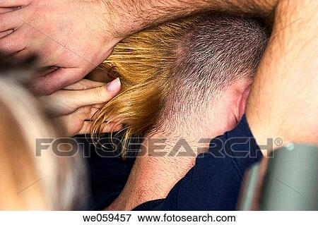 Young man, with the help of his sister, styling his hair into a Mohawk style View Large Photo Image Stock Photo - Young man, with the help of his sister, styling his hair into a Mohawk style. Fotosearch