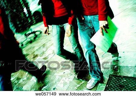 Stock Photo - Young people walking on the street. Fotosearch
