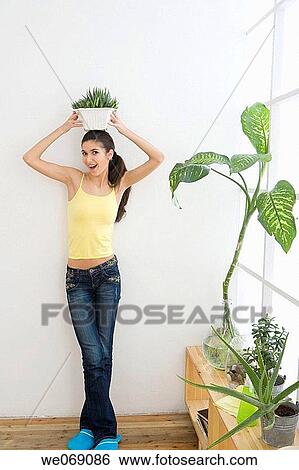 30's, balance, at-home, Arms raised, 20's View Large Photo Image Stock Photograph - 30's, balance, at-home, Arms raised, 20's. Fotosearch
