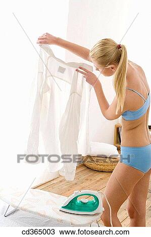 Stock Image - 30's, blond, at-home, appliance, 20's. Fotosearch