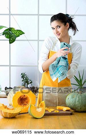 Stock Photography - 30's, board, at-home, apron, 20's. Fotosearch