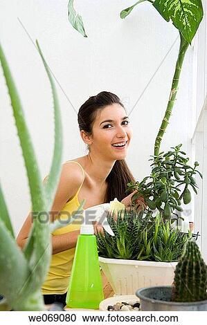 Stock Image - 30's, brunette, at-home, 20's. Fotosearch