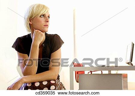 Stock Photography - absent-mindedness, blond, absorbed, Absent-minded. Fotosearch