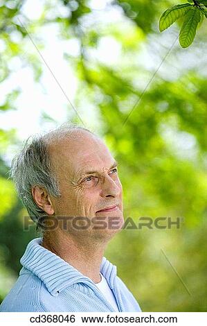 Stock Photograph - absent-mindedness, calm, absorbed, Absent-minded. Fotosearch