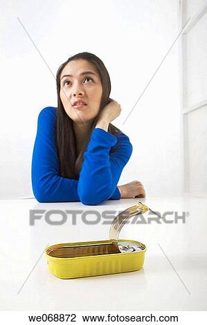 absorbed, can, Asian, 20's View Large Photo Image Stock Image - absorbed, can, Asian, 20's. Fotosearch
