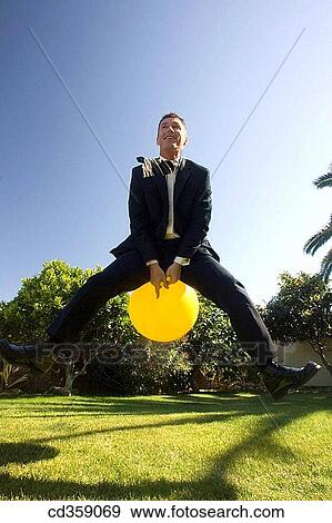 Stock Photo - activity, blue, ball, amusement, action. Fotosearch