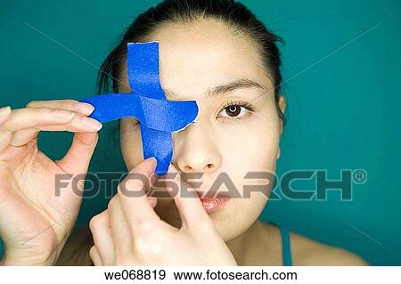 Adhesive tape, blindness, blind, Asian, 20's View Large Photo Image Stock Photo - Adhesive tape, blindness, blind, Asian, 20's. Fotosearch