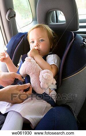 adjusting, Baby car seat, baby, automobile, adjust View Large Photo Image Stock Image - adjusting, Baby car seat, baby, automobile, adjust. Fotosearch