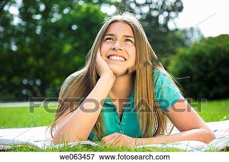 Stock Photo - adolescence, calm, blanket, absorbed. Fotosearch