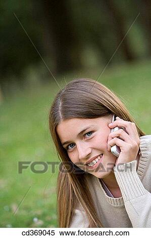 adolescence, cell phone, calling, blue eyes, addiction View Large Photo Image Stock Photography - adolescence, cell phone, calling, blue eyes, addiction. Fotosearch
