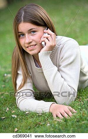 adolescence, cell phone, calling, addiction View Large Photo Image Stock Image - adolescence, cell phone, calling, addiction. Fotosearch