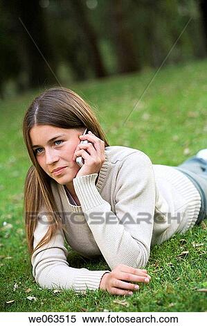 Stock Photography - adolescence, cell phone, calling, addiction. Fotosearch