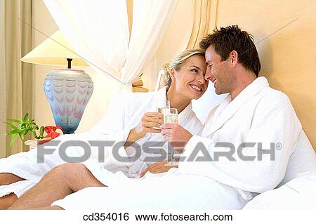 Stock Photograph - affection, bed, bathrobe, all-inclusive, accommodation. Fotosearch
