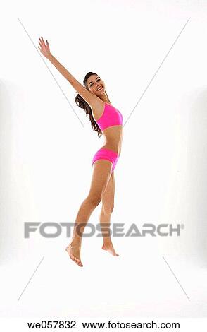 agile, brunette, Arms raised, agility, action View Large Photo Image Stock Image - agile, brunette, Arms raised, agility, action. Fotosearch