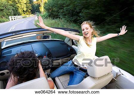 amusement, blurred motion, automobile, Arms open, 20's View Large Photo Image Picture - amusement, blurred motion, automobile, Arms open, 20's. Fotosearch