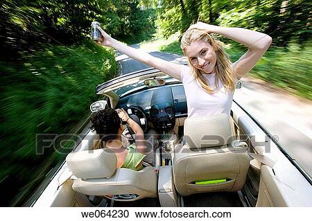amusement, blurred motion, automobile, Arms open, 20's View Large Photo Image Stock Image - amusement, blurred motion, automobile, Arms open, 20's. Fotosearch